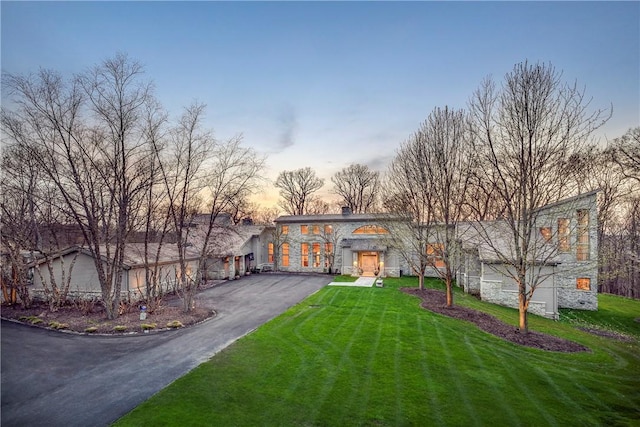 view of front of home with a yard