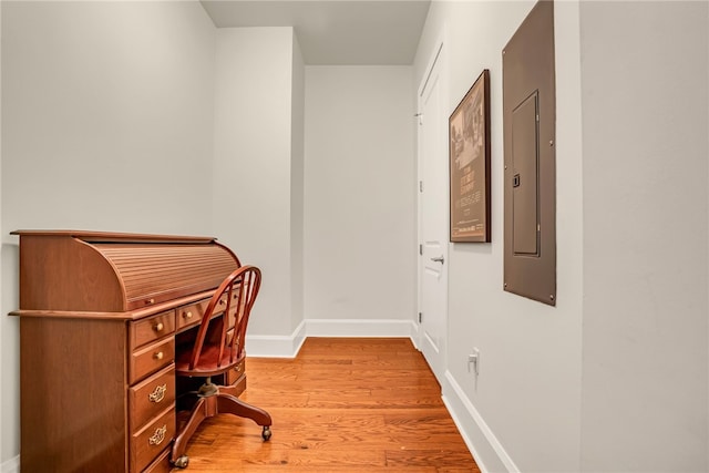 home office with wood-type flooring