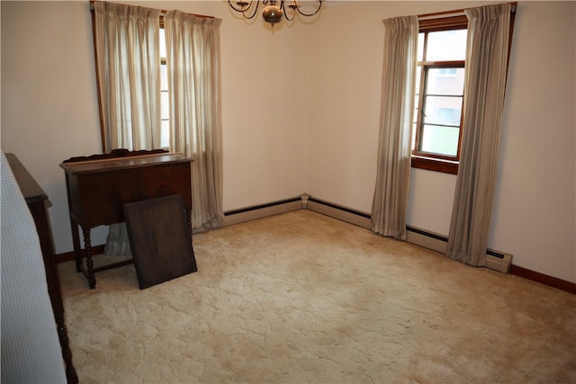 unfurnished room featuring a notable chandelier and light carpet