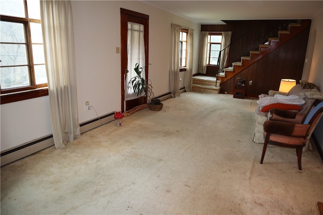 misc room featuring light carpet and a baseboard heating unit