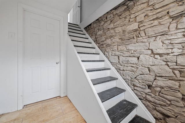 staircase with light tile floors