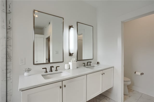 bathroom with vanity and toilet