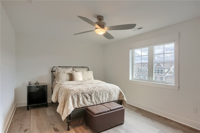 bedroom featuring ceiling fan and light hardwood / wood-style floors