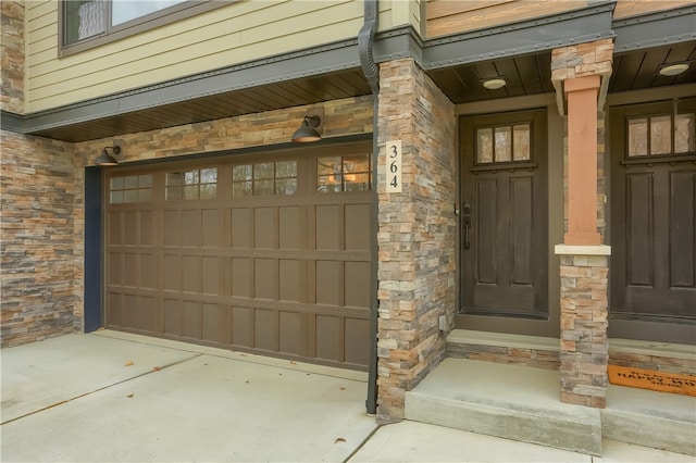 view of exterior entry featuring a garage