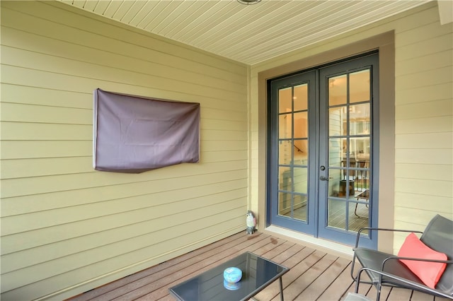 wooden deck featuring french doors