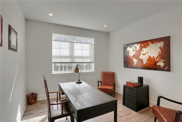 office space with light hardwood / wood-style flooring