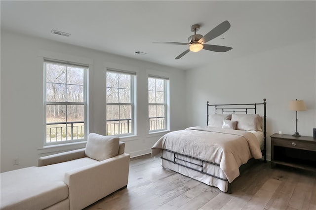 bedroom featuring ceiling fan and light wood-type flooring