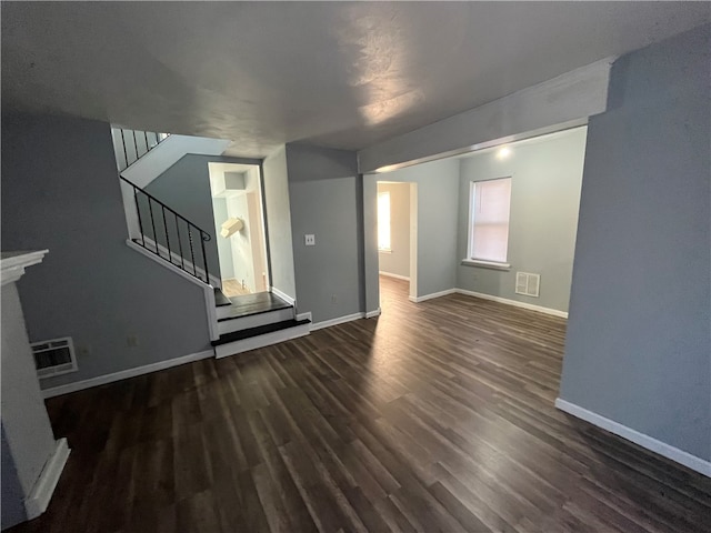 empty room with dark hardwood / wood-style floors