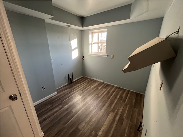 stairs with dark hardwood / wood-style floors