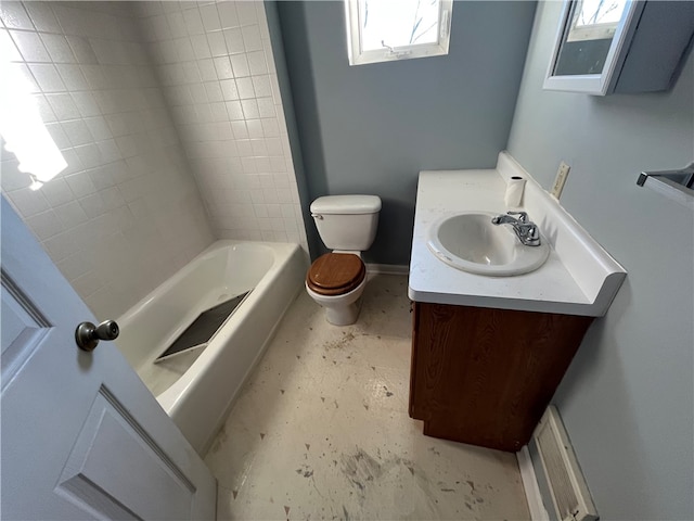 full bathroom featuring toilet, vanity, and tiled shower / bath