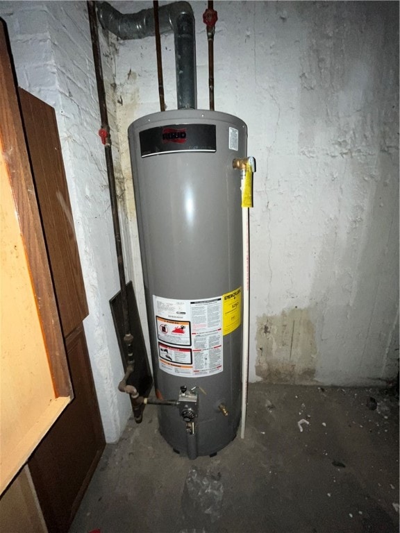 utility room featuring water heater