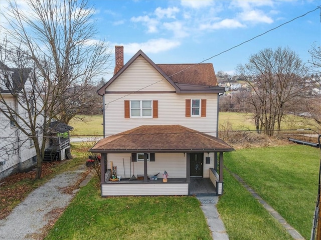 view of front of home featuring a porch and a front lawn