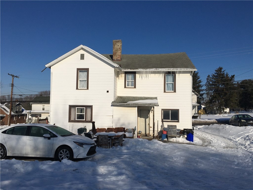 view of snow covered house