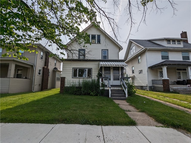 view of front of home with a front yard and a porch