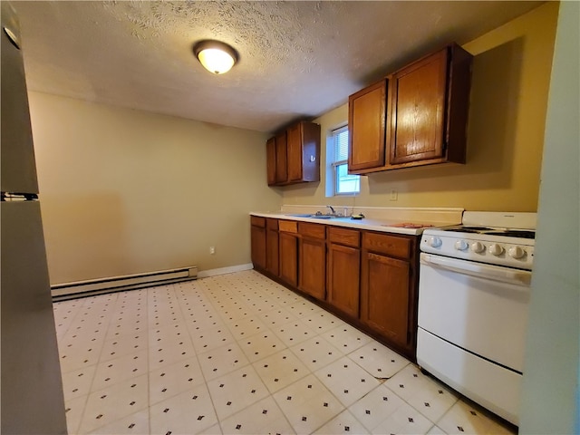 kitchen featuring a baseboard radiator, sink, a textured ceiling, and white range oven