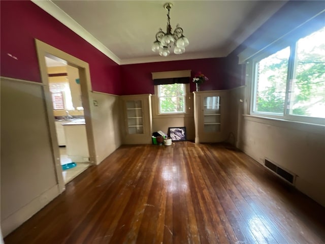 interior space with dark wood-type flooring and a notable chandelier