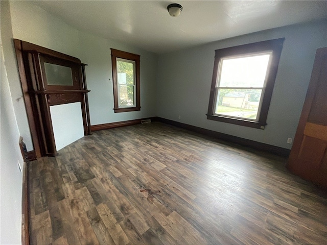 unfurnished bedroom featuring dark hardwood / wood-style flooring