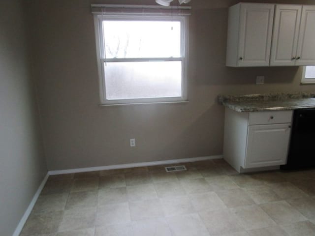 unfurnished dining area featuring a wealth of natural light