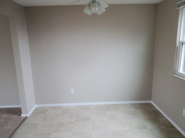 unfurnished room featuring ceiling fan