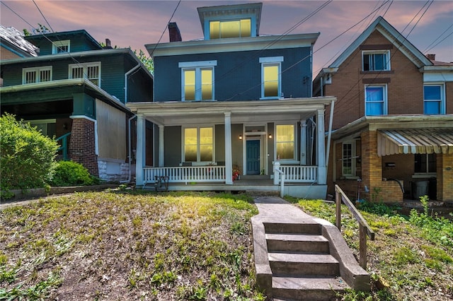 view of front of property featuring covered porch