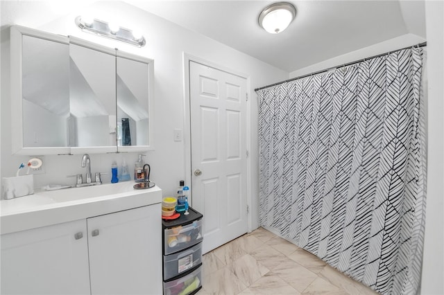 bathroom with large vanity and tile flooring