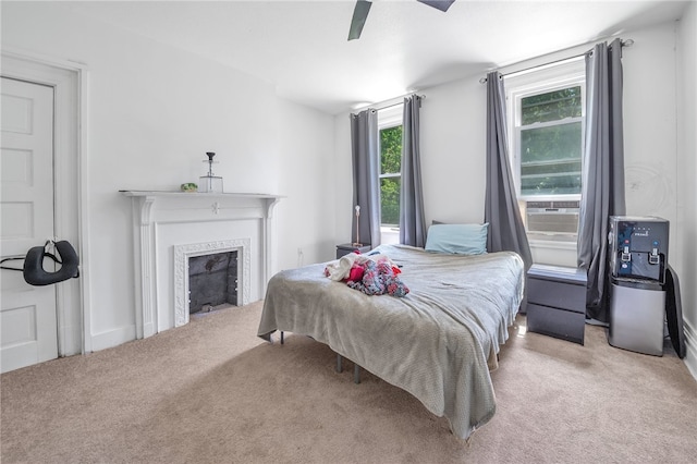 carpeted bedroom featuring ceiling fan