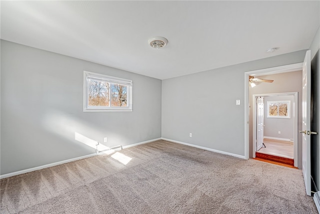 carpeted empty room with ceiling fan