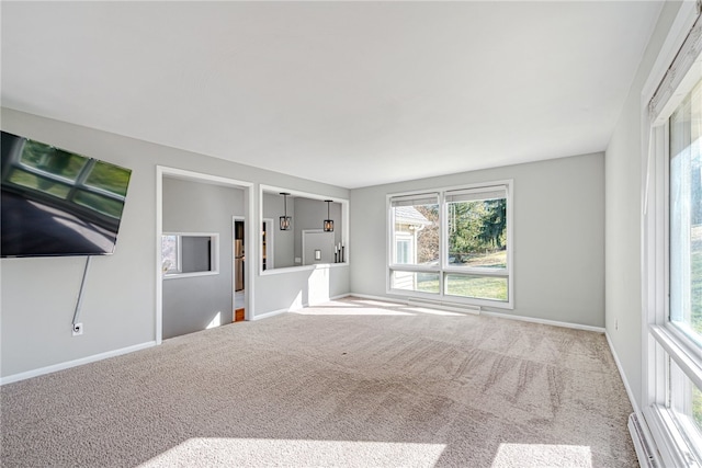 unfurnished living room featuring light colored carpet