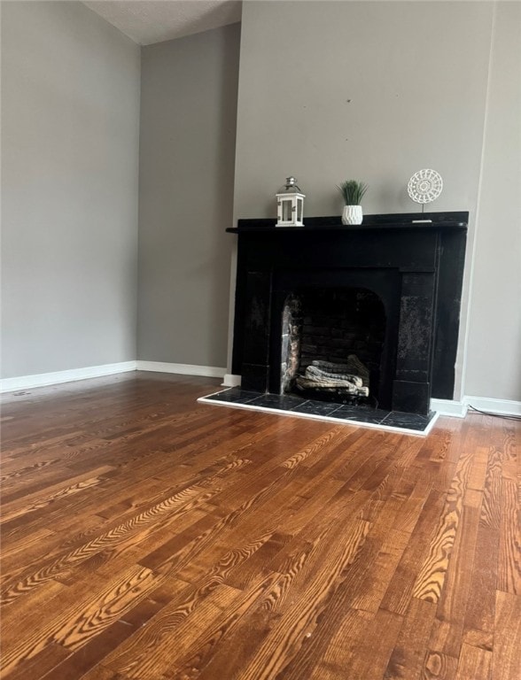 unfurnished living room with hardwood / wood-style floors