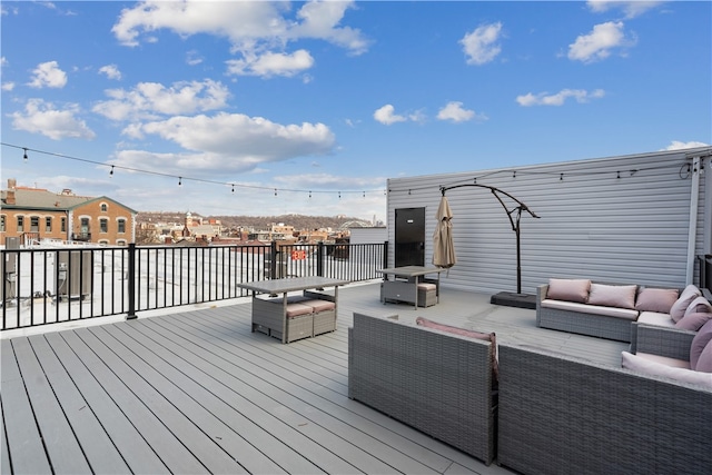 wooden deck with an outdoor living space