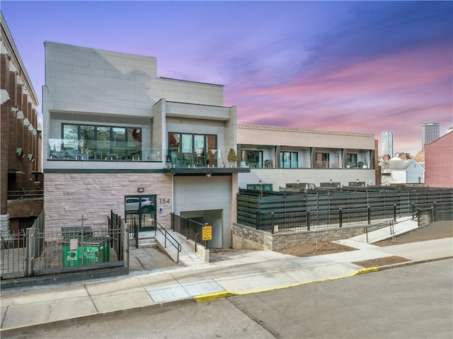 view of outdoor building at dusk