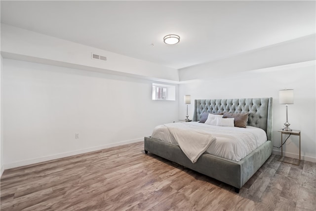 bedroom with light hardwood / wood-style flooring