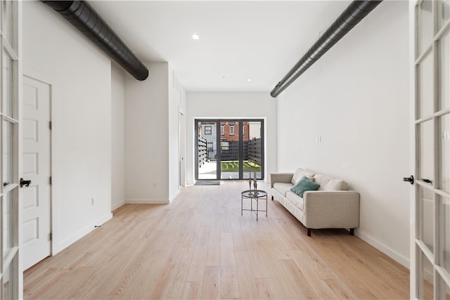 sitting room with light hardwood / wood-style floors