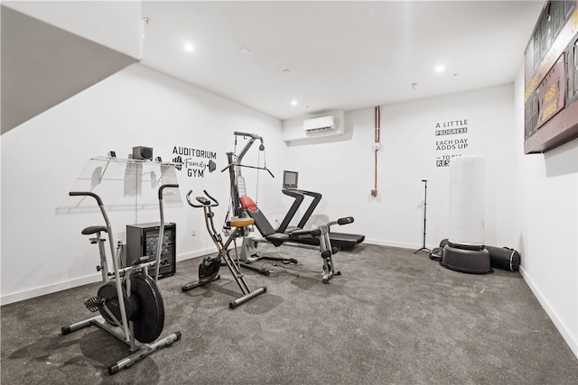 exercise area featuring a wall mounted AC