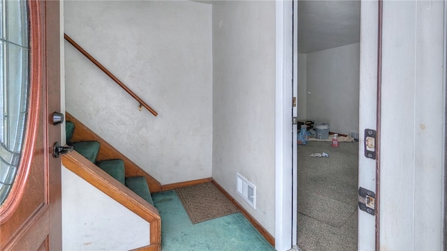 staircase with carpet flooring