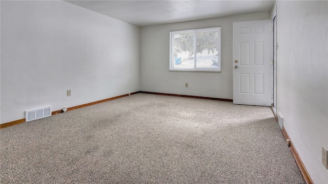 spare room with light colored carpet