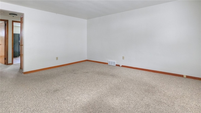 spare room with light colored carpet