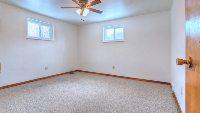 unfurnished room featuring light colored carpet and ceiling fan