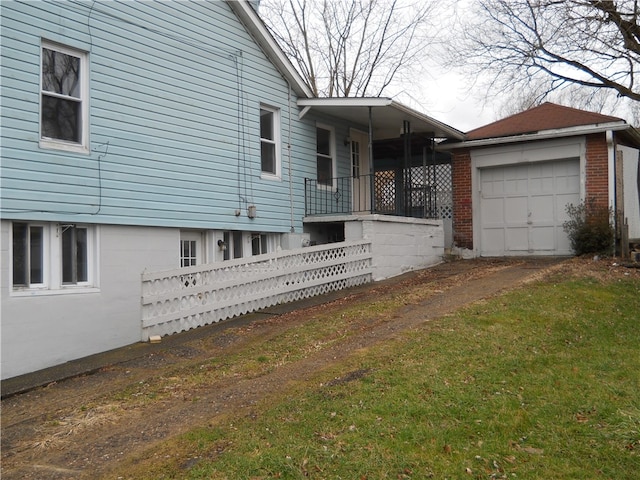 exterior space with a front lawn and a garage