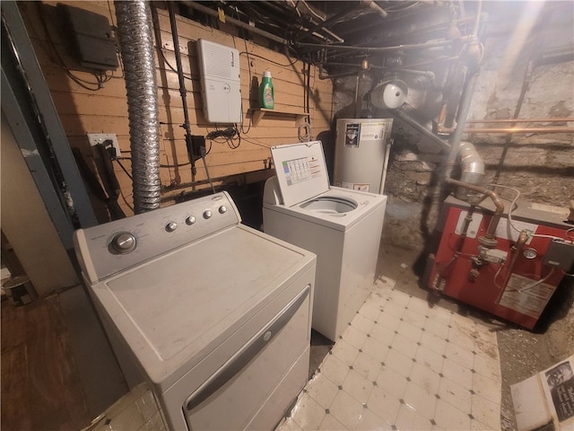 laundry room featuring gas water heater, separate washer and dryer, light tile floors, and hookup for an electric dryer