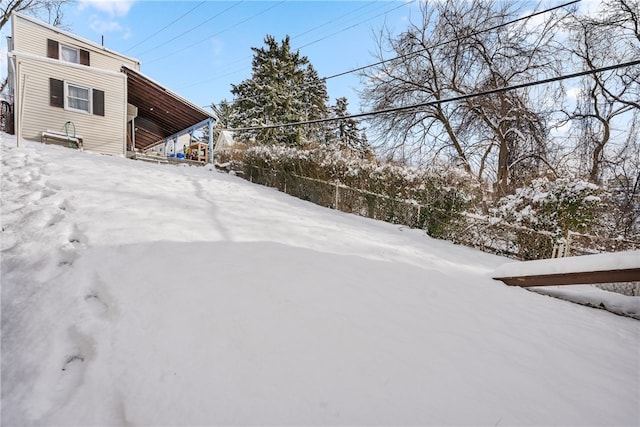 view of yard layered in snow