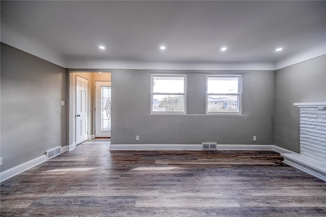 unfurnished room with dark hardwood / wood-style floors