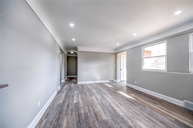 empty room with dark wood-type flooring