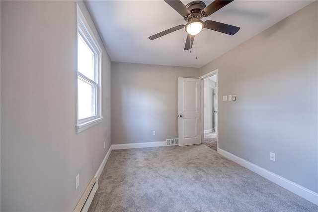 unfurnished bedroom featuring ceiling fan and light colored carpet