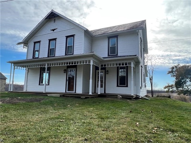 view of front of home with a porch and a front yard