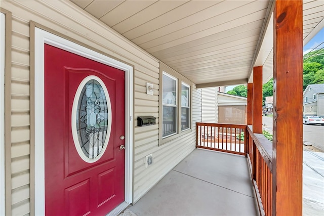 entrance to property featuring a porch