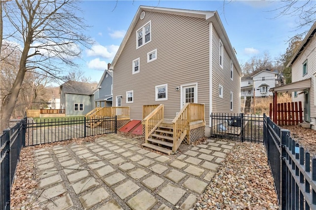 back of property featuring a patio area