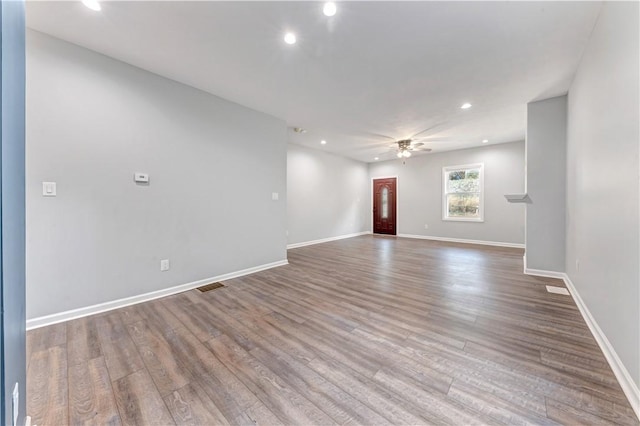 empty room featuring ceiling fan and wood-type flooring