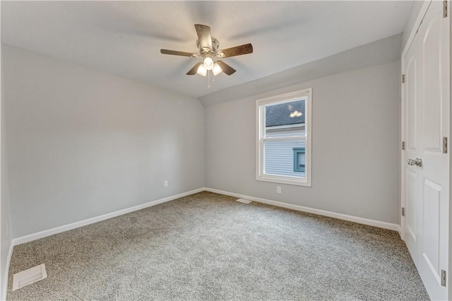 unfurnished room with ceiling fan and carpet floors