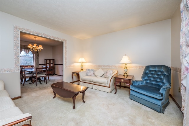 carpeted living room featuring a chandelier and a textured ceiling